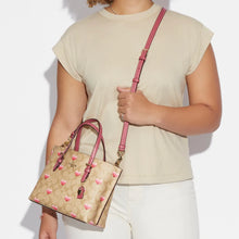 Cargar imagen en el visor de la galería, MOLLIE TOTE 25 IN SIGNATURE CANVAS WITH STRIPE HEART PRINT