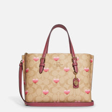 Cargar imagen en el visor de la galería, MOLLIE TOTE 25 IN SIGNATURE CANVAS WITH STRIPE HEART PRINT
